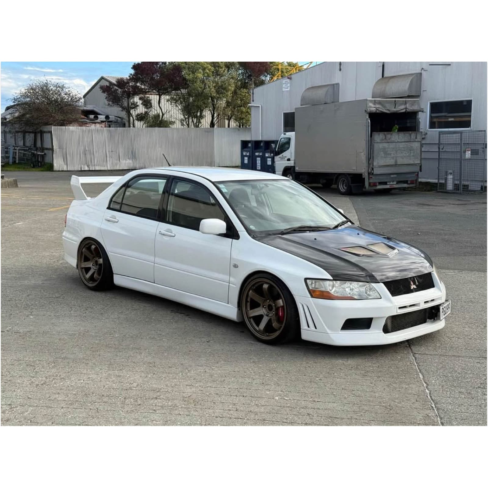 A Mitsubishi Lancer Evolution VII — popular with both 25-year personal-import buyers and SEVS-route buyers chasing the Evo X.
