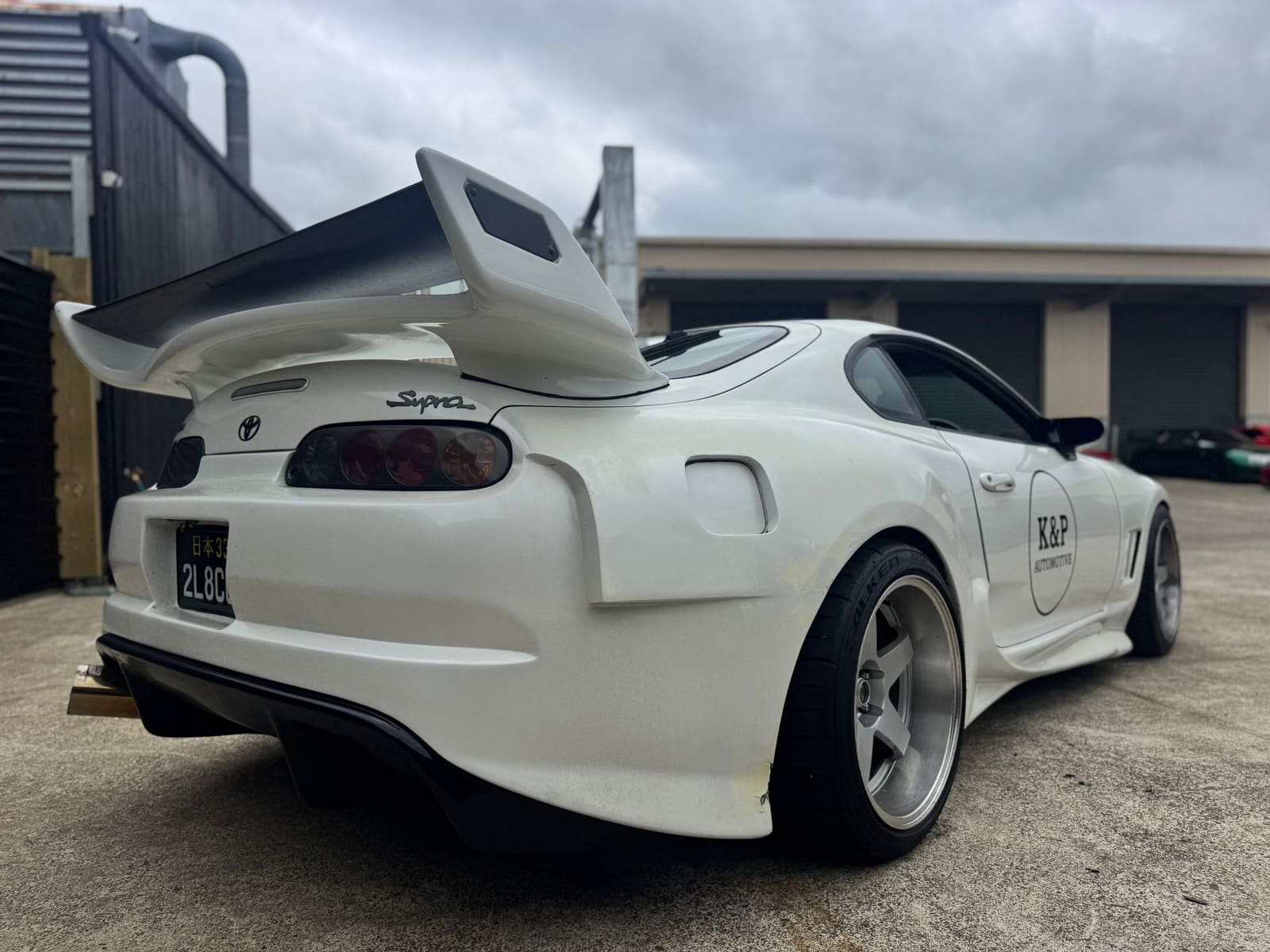Toyota Supra Mk4 with rear wing prepared for container shipping at Importify